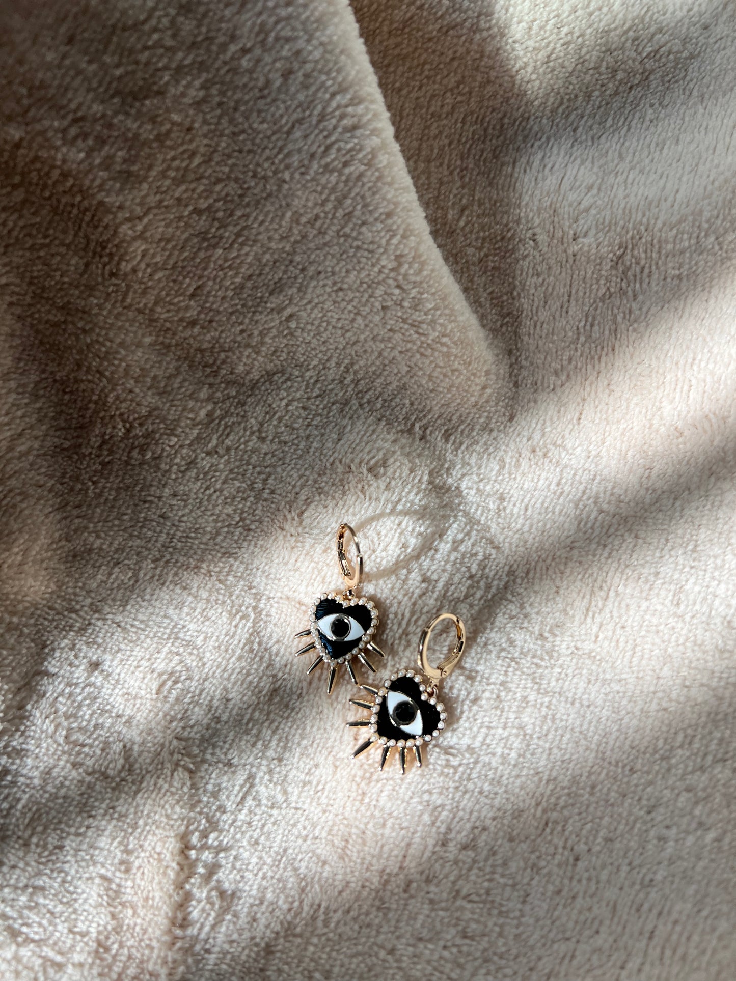 “EVIL EYE” spiked heart earrings